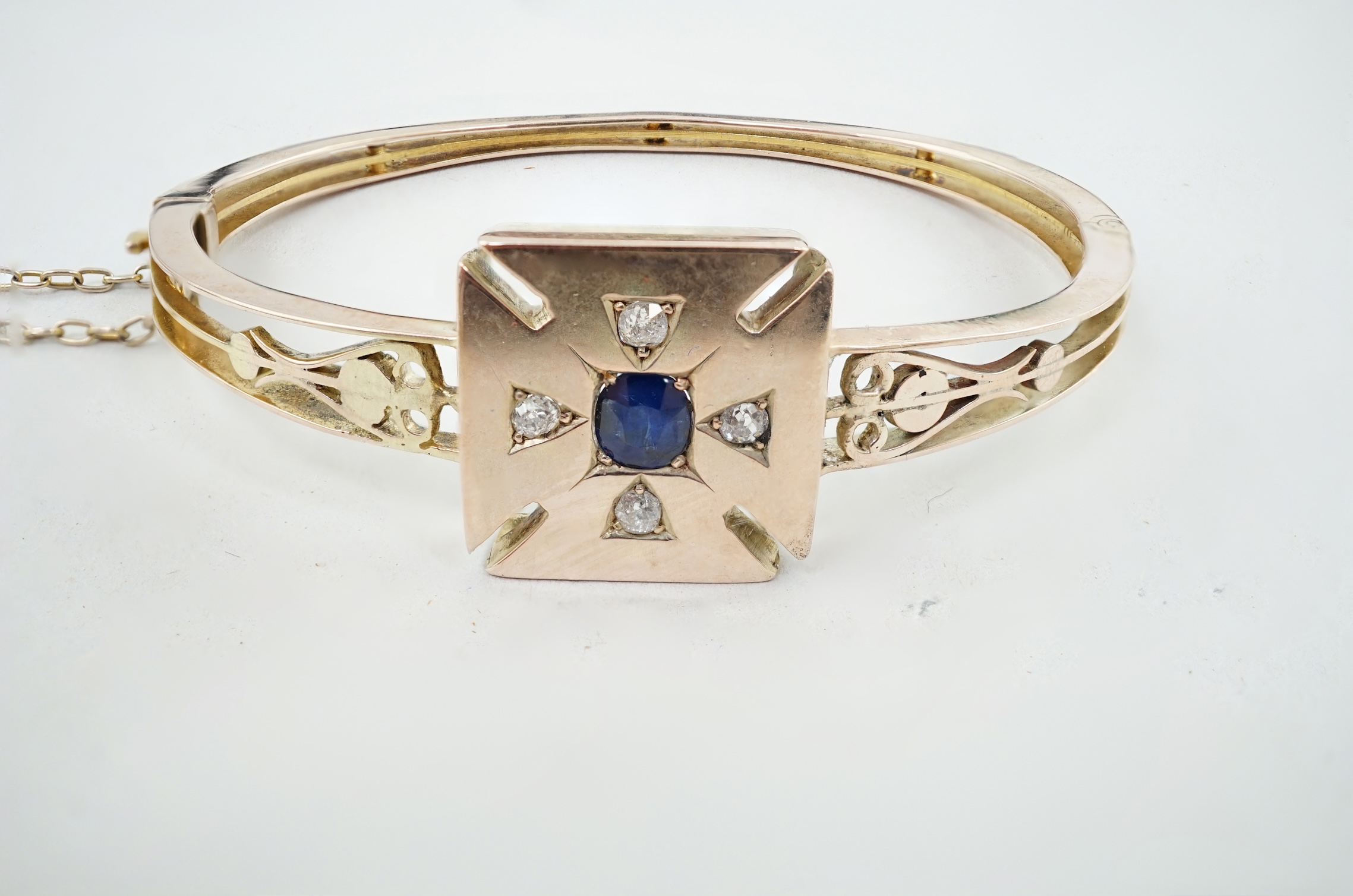 A Victorian gold, single stone sapphire and four stone diamond set hinged bracelet